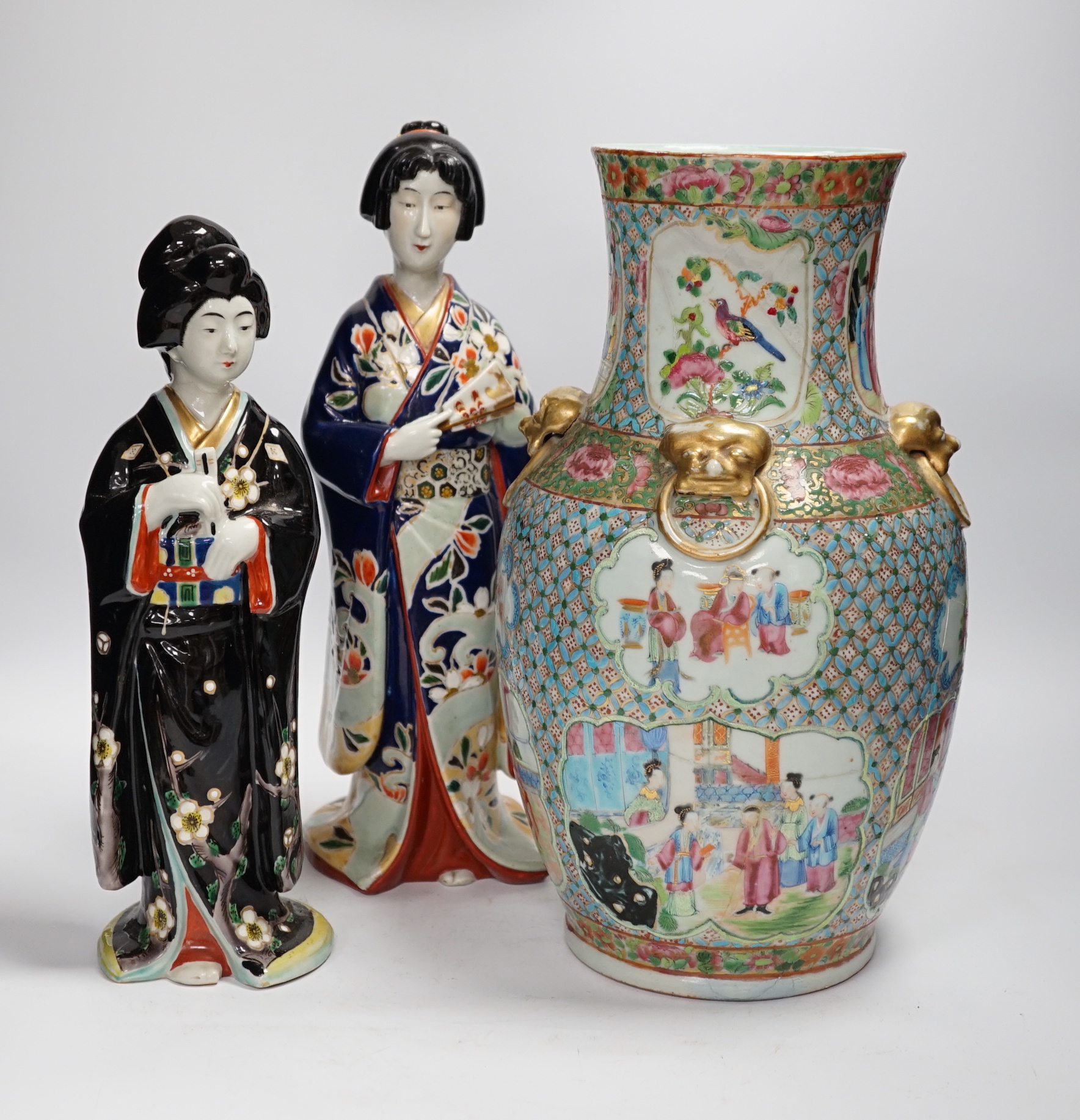 Two Japanese figures wearing kimonos, early 20th century and a 19th century Chinese famille rose vase, largest 34cm high